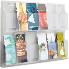 a clear plastic storage bin with six compartments for cards and brochures in it