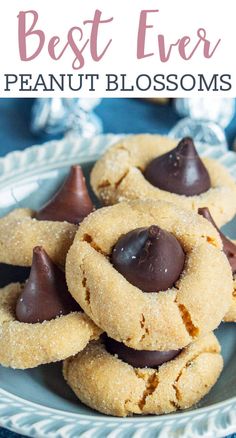 chocolate dipped peanut butter blossoms on a plate with text overlay that reads best ever peanut blossom cookies