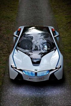 a futuristic car parked on the side of a road