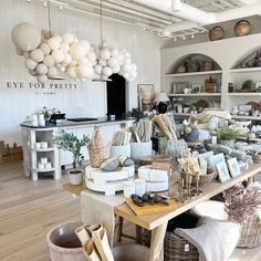 a room filled with lots of different types of furniture and decor on top of wooden floors