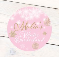 a pink and gold sticker with snowflakes on it that says matilda's winter wonderland