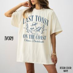 a woman wearing a t - shirt that says last toast on the coast