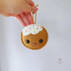 a crocheted donut ornament hanging from a string