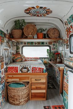 the interior of an rv with colorful tiles on the walls and floor, including a bed