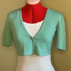 Aqua Button Up Crop Sweater. Semi Fitted. 100% Cotton. Yarn And Button Attached. Fitted Green Cardigan For Summer, Fitted Cropped Cotton Cardigan, Fitted Green Cotton Cardigan, Summer Cotton Cardigan With Buttons, Fitted Button-up Cardigan For Summer, Fitted Cotton Cardigan With Buttons, Fitted Cotton Button-up Cardigan, Fitted Button-up Cotton Cardigan, Vintage Fitted Summer Cardigan