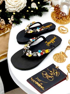 Description The beautiful rhinestone and customizable Flip Flops for the beach brides, bridesmaids, vacation, honeymoon or any occasion you desire to look gorgeous. Perfect in any outfit! Being unique and stunning on design, these flip flops must be your must-have item! The sandal is anti-slip, comfortable and durable as it is made from high quality rubber from the South of Thailand, where is famous for the best rubber tree. Moreover, the crystals are decorated on the sandal with effective adhes Black Rhinestone Flip Flops For Beach, Bling Flip Flops, Beach Wedding Sandals, Bling Design, Sandals Beach, Rubber Tree, Beach Bride, Rhinestone Sandals, Wedding Sandals