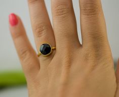 "Black Onyx Solitaire Cushion Ring Gold Available in 18K Gold Vermeil or 925 Sterling Silver. Please select size and metal option from drop down menu. This listing is for the following 1 (ONE) ring: ✦Gemstone: Black Onyx ✦Stone Cut: Square, Round, or Teardrop ✦Stone Size: Approximately 9mm (0.35\") ✦Metal: 18K Gold Vermeil or 925 Sterling Silver *Because we use natural stones, the stones may vary slightly in shape, size and color. *Each item is packaged individually in a GIFT BOX Please view my Black Onyx Ring Gold, Rings Ideas, Black Stone Ring, Teardrop Ring, Cushion Cut Ring, Cushion Ring, Onyx Jewelry, Bezel Ring, Black Onyx Stone