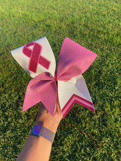 Pink cheer bow for October Breast Cancer Awareness. Color customization available. Coaches: contact me for full team orders, specialized customization, or a unique bow design. Pink Out Cheerleaders, Pink Out Bows, Cheer Bow Ideas High Schools, Pink Out Cheer Bows, Diy Cheer Gifts For Team, Cheer Bows Ideas, Pink Out Cheer, Cheer Spirit Sticks, Pink Cheer Bow