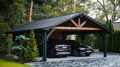 two cars are parked in the driveway under a covered carport with trees and bushes