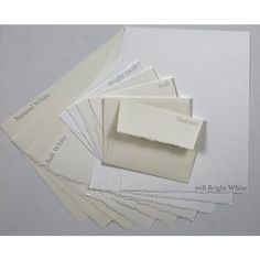 several different shades of white paper on top of each other