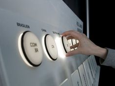 a person is pressing buttons on a machine