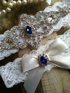 DESCRIPTION *Ivory or Bridal White Lace with 10 different center choices to choose from! *Gorgeous Crystal Clear Rhinestones! *Custom to Fit You! *NO SLIP GRIP INCLUDED AT NO ADDITIONAL CHARGE! *GIFT BOX AT NO ADDITIONAL CHARGE! LET THIS BE YOUR SOMETHING BLUE! (Or any color you choose) This beautiful, vintage inspired, 1.5 inch bridal white or ivory lace applique wedding garter set includes the Keepsake and Toss garters and will be perfect for you on your special day! The Keepsake garter is des Bride Garter, Bridal Garter Lace, Lace Garter Set, Garter Toss, Blue Garter, Something Blue Bridal, Wedding Garter Set, Wedding Garters, Applique Wedding