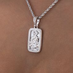 Introducing the Icon Shepherd Pendant, a statement piece in 14k White Gold. This piece features intricately designed imagery of the Shepherd with an iced out halo, a Cuban link border and finished with an iced out bail. This standout piece is a must have and pairs perfectly with our 4mm Rope Necklace. This product is guaranteed for life - GLD will repair the item should you experience any defects in craftsmanship or breakage. Specifications - 18mm x 30mm (Width x Height) - Weight: (Weight can va Iced Sterling Silver Jewelry In Diamond White, White Iced Out Jewelry, White Diamond Jewelry With Iced Detail, White Diamond Iced Jewelry, White Iced Diamond Jewelry, Iced White Gold Jewelry For Anniversary, 14k White Gold Iced Out Jewelry, White Iced Out Fine Jewelry, Iced Out White Fine Jewelry