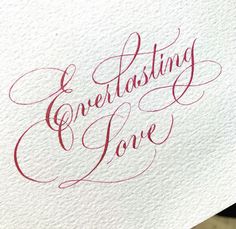 a piece of paper with writing on it that says, creating love written in red ink