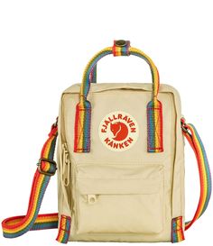 From Fjallraven&#x2C; the Patch Logo Kånken Rainbow Handle Sling Bag features:VinylonIncludes seat pad stored in an inside pocket in the back of the main compartment2 open side pockets and one zippered pocket on the frontName label inside the main compartmentApprox. 23cm heightApprox. 16L volumeApprox. 0.66 lb. weightImported.Special edition and part of the Arctic Fox Initiative supporting climate/environmental projects Kanken Sling, Environmental Projects, Save The Arctic, Fjällräven Kånken, Small Travel Bag, Sling Pack, Compact Bag, Light Backpack, Arctic Fox