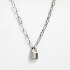 Add a playful touch to your jewelry collection with the Isabella Lock Pendant. Featuring a trendy paperclip chain and lock necklace, this piece is both stylish and functional. Perfect for everyday wear, it is sure to become a staple in your wardrobe. Chain length = 16 in + 2 in extender Lock size - 0.5 in Lock Chain Necklace, Lock Pendant, Chunky Chain Necklaces, Lock Necklace, Paper Clip, Chain Lengths, Chain Length, Gold Pendant, Chains Necklace