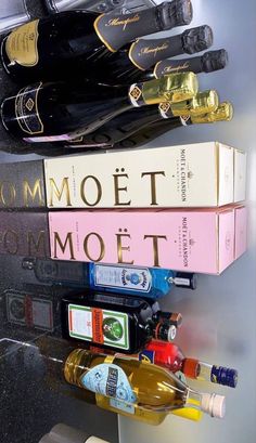 three wine bottles are stacked on top of each other