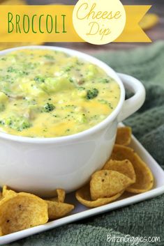 broccoli cheese dip in a white bowl with tortilla chips on the side