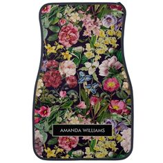 a car mat with an image of flowers and leaves on the front, which reads amanda williams