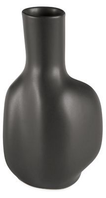 a black vase sitting on top of a white table