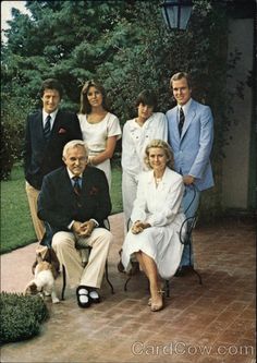 a group of people and a dog posing for a photo