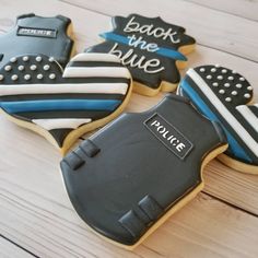 cookies decorated like police uniforms and the words back to the blue