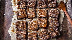 chocolate brownies with caramel drizzled on top, cut into squares