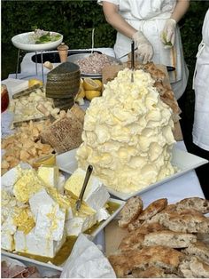 a table filled with lots of different types of desserts and pastries on it