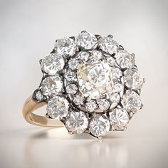 This item has just been reserved by another customer. Please contact us to be notified if it becomes available.  A beautiful Victoria cluster ring has a total weight of 3.92ct of old-cut diamonds. This ring is featuring a stunning 1.52-carat antique cushion-cut diamond in the center. This Prong-set diamond has K color and VS2 clarity. An old European cut diamond double halo with approx of 2.40 carats surrounds the center stone.  The double halo creates a unique floral head design. This ring has Clustered Diamond Ring, Luxury White Victorian Diamond Ring, Victorian Diamond Cluster Ring, Victorian Diamond Ring With 17 Jewels, Luxury Yellow Gold Cluster Halo Ring, Antique Cluster Diamond Ring With Diamond Cut, Antique Cluster Diamond Cut Diamond Ring, Antique Halo Setting Diamond Ring For Formal Occasions, Antique White Gold Diamond Ring With Halo Setting