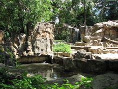 there is a waterfall in the middle of some rocks