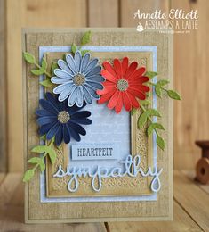 a card with flowers on it and the words sympathy written in blue, red, and green