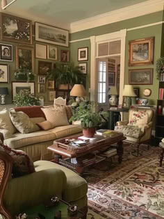 a living room filled with lots of furniture and pictures on the wall above it's windows