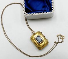 "Vintage gold filled chain and Victorian rectangle photo locket cameo pendant necklace, In good antique vintage condition. The chain 19\" long, Pendant 1\" x 5/8' and ½\" thick. Pendant dates 1890's. Weighs 6.9 gram. Marked 1/20 14k GF on the clasp. Thanks." Antique Rectangular Formal Necklace, Vintage Rectangular Locket Jewelry, Antique Gold Necklace With Rectangular Pendant, Victorian Gold Rectangular Necklace, Victorian Engraved Rectangular Necklace, Victorian Rectangular Gold Necklace, Antique Rectangular Brass Jewelry, Vintage Square Pendant Locket Jewelry, Vintage Rectangular Locket Pendant