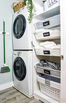 a washer and dryer are in the closet next to each other with baskets on them