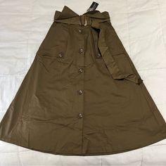 Brand New Long Skirt With Tags! Army Green Color. The Skirt Comes Above The Ankles Any Questions Feel Free To Comment Below Casual Belted Midi Skirt, Chic Khaki Skirt For Fall, Belted Brown Skirt For Spring, Brown Belted Skirt For Spring, Casual Midi Length Belted Skirt, Casual Belted Midi Bottoms, Casual Long Belted Skirt, Chic Khaki Skirt For Spring, Orange Midi Skirt