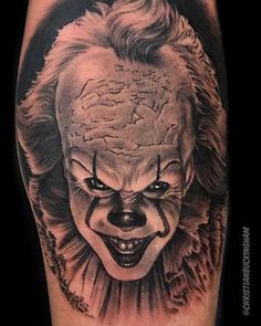 a tattoo with a creepy clown face on it