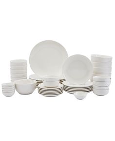 a stack of white plates and bowls