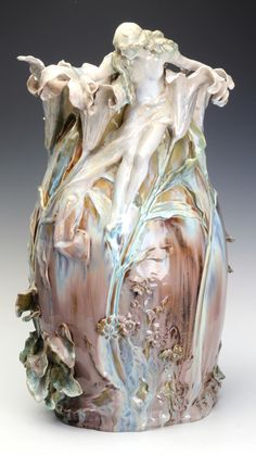 a vase with an artistic design on it