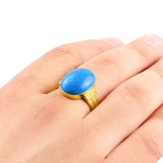 Metal: 14k Yellow Gold Turquoise*: 1.3cm x 1.8cm (0.5" x 0.7") shape - Oval cabochon setting type - Bezel setting *stone may vary in tone or pattern. Please allow for these natural variations. Product weight: 5.0 gr A delightful design for every occasion dressed in regal hues! Crafted from 14k gold, this gorgeous ring boasts a single blue turquoise stone. This piece will wrap around your finger with bold style so you can wear it anytime, anyplace ------------------------------------------------- Blue Turquoise Oval Cabochon Ring In 14k Gold, Formal 14k Gold Turquoise Blue Ring, Blue Turquoise 14k Gold Oval Cabochon Ring, Blue Oval Cabochon Turquoise Ring In 14k Gold, 14k Gold Blue Oval Cabochon Turquoise Ring, Stone Ring For Men, Gold Rings Online, Stone Rings For Men, Turquoise Men