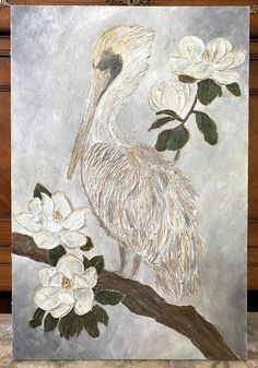 a painting of a pelican on a branch with white flowers