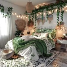 a bedroom decorated in green and white with plants hanging from the ceiling, lights strung over the bed