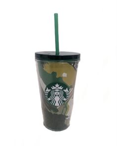 the starbucks cup has a green straw in it