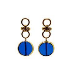 Another version of our Blue Circle Earrings, which is sold out and a customer favorite are these transparent blue circles. The German vintage glass beads that is framed with 24K gold hangs on a 24K gold plated circle earring studs. The vintage German glass beads were hand pressed during the 1920s- 1960s. No two beads are exactly alike. These beads are “New Old Stock” and are almost, if not some are 100 years old. These beads are no longer in production thus making them rare and highly collectibl Modern Blue Brass Earrings, Formal Gold Glass Earrings, Handmade Blue Round Clip-on Earrings, Gold Glass Earrings For Pierced Ears, Elegant Blue Circular Jewelry, Nickel-free Blue Circular Earrings, Blue Nickel-free Round Earrings, Nickel-free Blue Earrings, Blue Round Glass Earrings