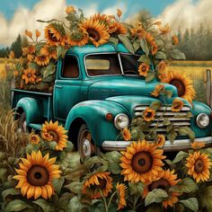 an old blue truck with sunflowers on the bed is parked in a field