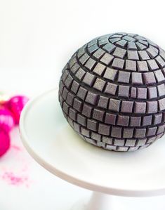 a cake that has been made to look like a ball on top of a plate