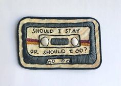 a patch with an old fashioned radio on it that says, should i stay or should i go?