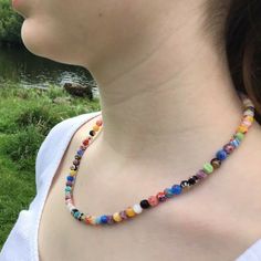 "This beautiful Millefiori Glass necklace is designed and made in Ireland. The toggle clasp is pewter. The necklace is 18\" in length, is made on wire and has a toggle clasp which is easy to put on and off. The necklace can be made longer or shorter. There are also matching bracelet options. Millefiori Glass is a type of mosaic glassware characterised by a flowerlike pattern. The term millefiori is a combination of the Italian words Mille meaning thousand and fiori meaning flowers." Meaning Flowers, Italian Words, Matching Bracelet, Colourful Necklace, Matching Bracelets, Toggle Clasp, Glass Necklace, Initial Necklace, Mosaic