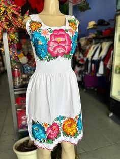 100% Authentic Mexican Dress  This Dress is gorgeous. Once size fit up to S/M Color: White This dress can feet up to M This dress has elastic an the waist  Ebroidery Mexican Dress.Boho Chic Dress Folk Fabric Flowers Mexican Tunic Traditional Embroidery This Dress is perfect for those beach day or any occasion This Dress is meant to provide extreme comfort throughout the day The perfect gift for her Mexican Embroidery Dress, Folk Fabric, White Mexican, Mexican Embroidery, Mexican Dress, Traditional Embroidery, Boho Chic Dress, Mexican Dresses, Authentic Mexican