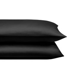 three black pillows stacked on top of each other