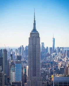 an aerial view of the empire building in new york city, with skyscrapers and other tall buildings